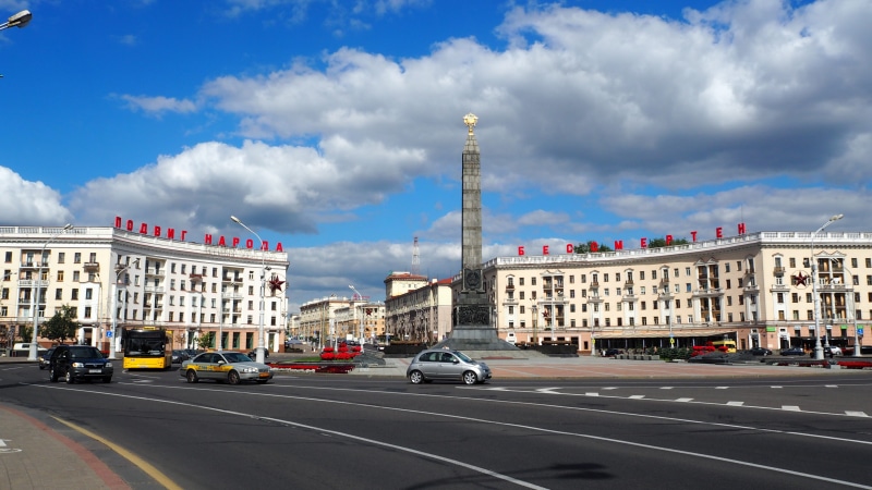 architecture, outdoors, travel, motor vehicle, car, city street, marking, road marking, cloud - sky, cityscape, city, building exterior, land vehicle, minsk