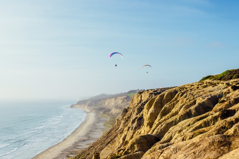ocean, summer, water, rock - object, wild, land, leisure, activity, beauty in nature, shore, recreational Pursuit, tropical, parasail, extreme, sport, life