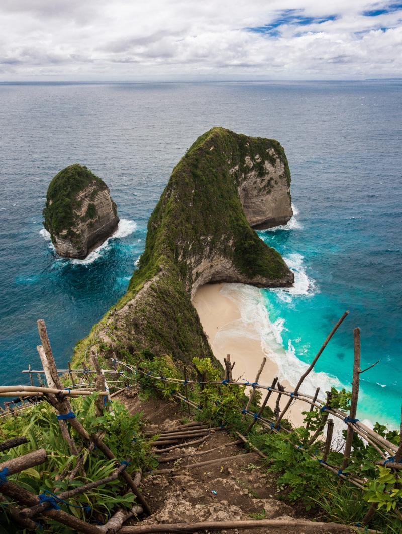 promontory, tree, cliff, daytime, rock - object, beach, day, blue, blue sea, indonesia, peak, seashore, explore, bridge, island, outdoors, kelingking beach