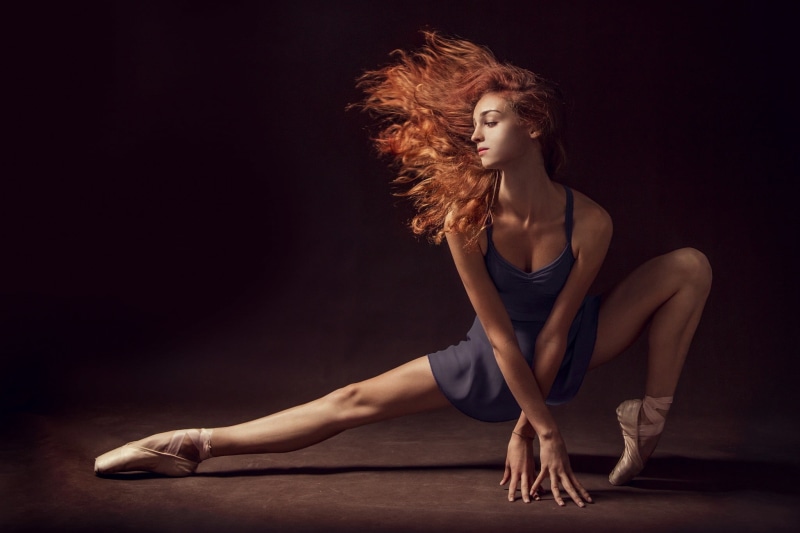studio shot, model, hairstyle, beautiful people, dancing, human body part, redhead, balance, hair, indoors, adult, beautiful woman, one person, human limb