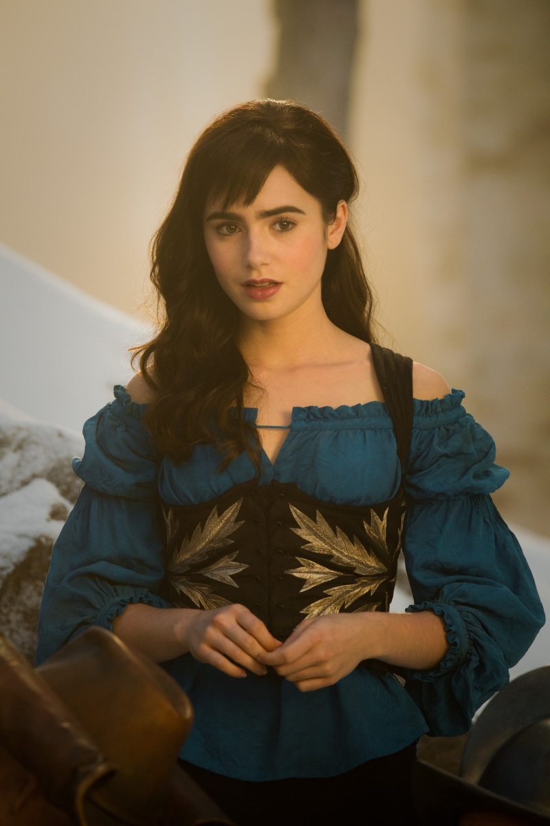 portrait display, beauty, hair, sitting, actress, three quarter length, looking at camera, Lily Collins, brown hair, corset, adult, 2K, celebrity, young adult