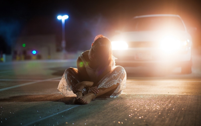 sitting, front view, suicide, full length, white clothing, one person, sadness, transportation, adult, brunette, looking, street, women, young adult, night