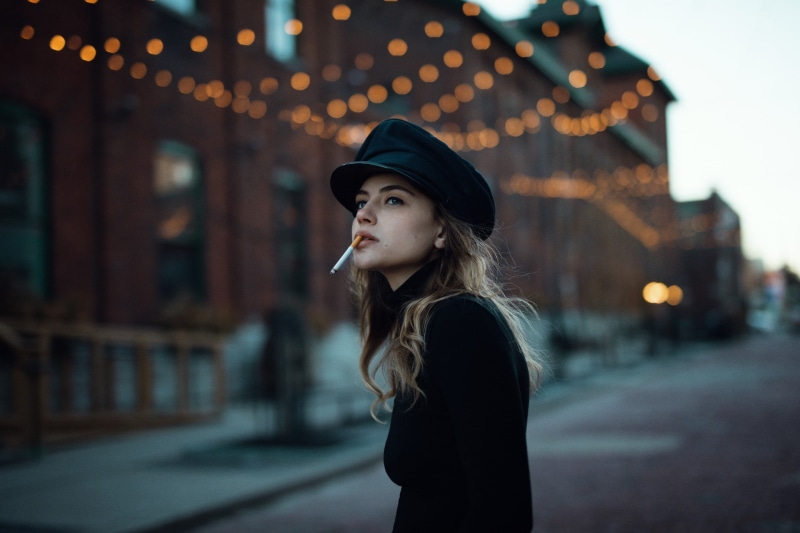 one person, black clothing, leisure activity, standing, hairstyle, smoking, beauty, adult, street, side view, beautiful woman, young women, 1080P, profile view