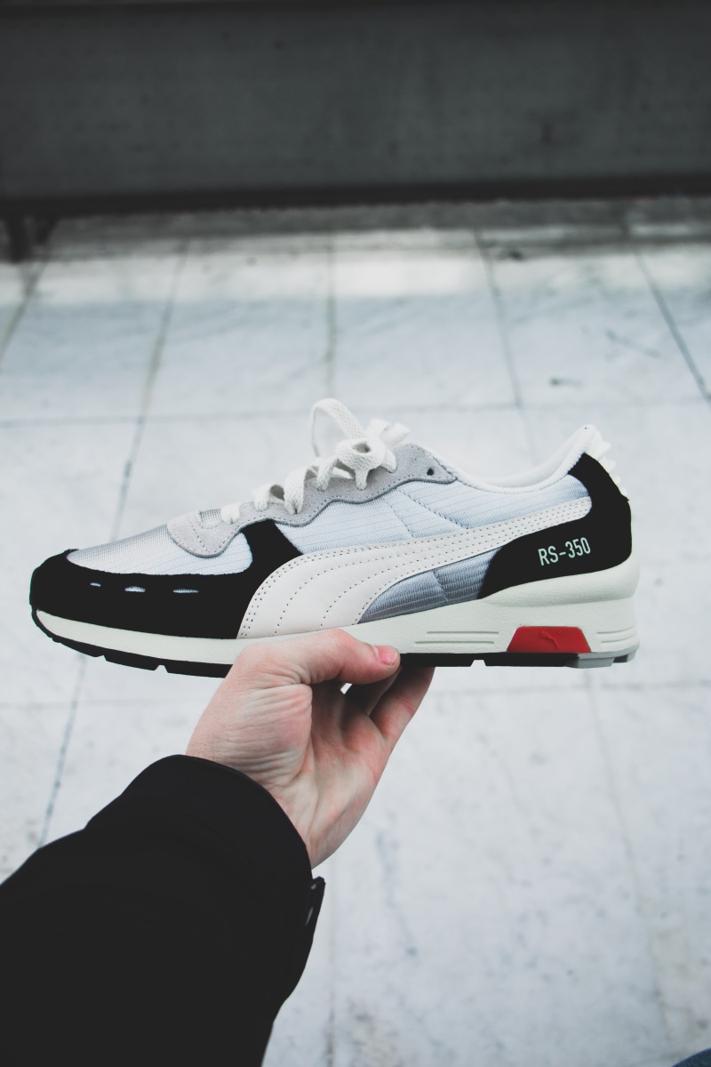 personal accessory, focus on foreground, puma, shoe, men, finger, photography, low, black, locker, close-up, hand, rs, human body part, unrecognizable person