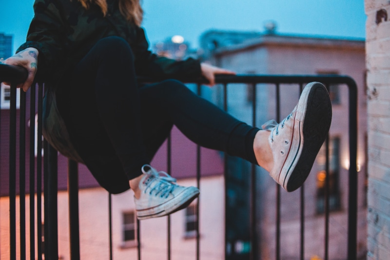 real people, 5K, clogs, lifestyles, pants, footwear, sports, focus on foreground, adult, black, dating, architecture, hairstyle, leisure activity, clothing