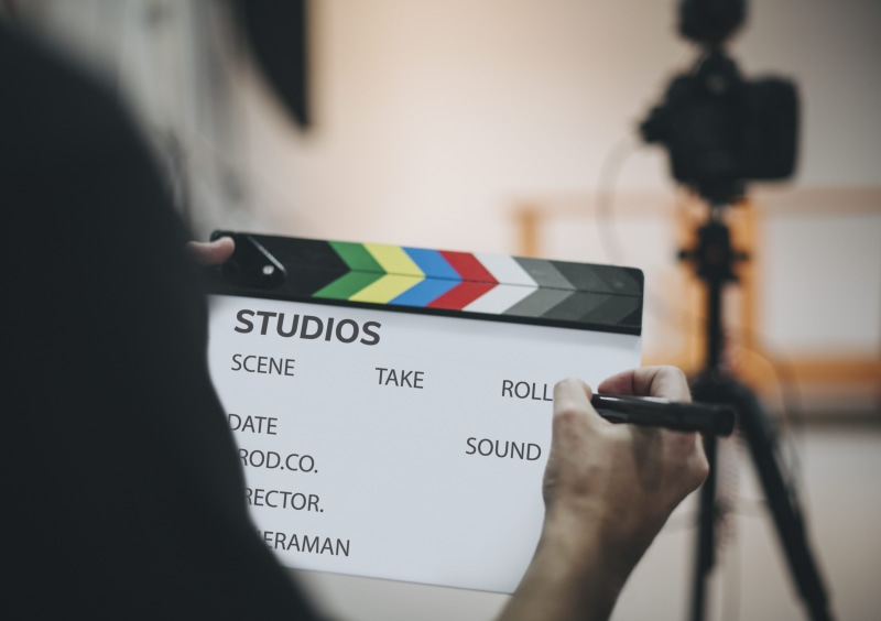 woman, person, 4K, object, human body part, filming, text, equipment, indoors, finger, focus, studio, preparation, close-up, human hand, western script