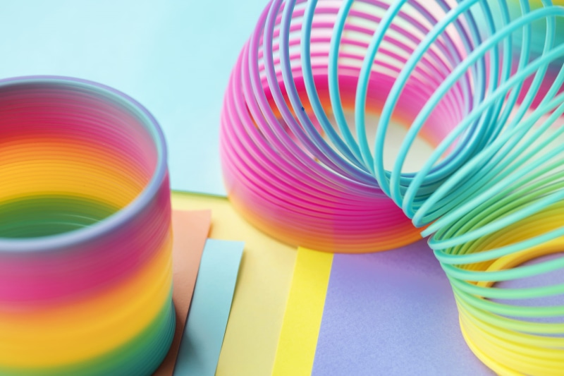 blue background, motley, stretch, spiral, wire, prism, equipment, plastic, artistic, rainbow, colored background, variation, blue, flexible, still life