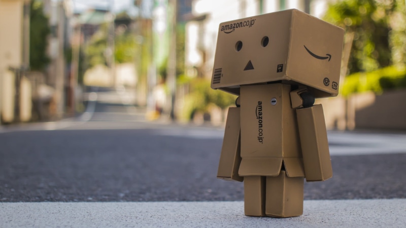 illustration, robot, city, representation, Amazon, text, road, focus on foreground, close-up, western script, street, paper, human representation, day
