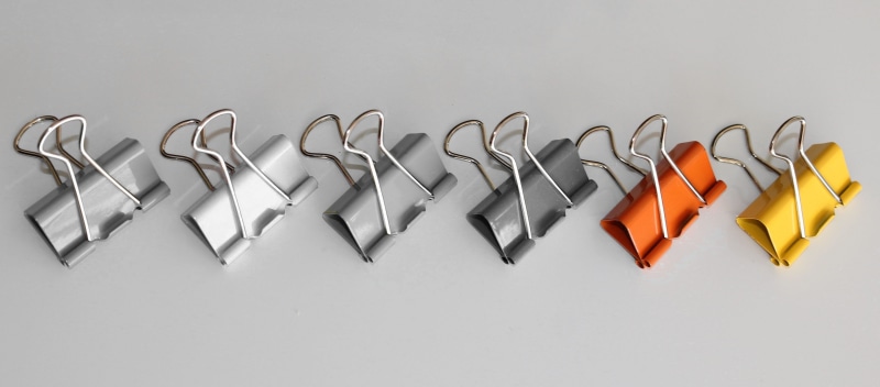 office, stationery, white color, banner, coat hook, 4K, in a row, binder, assorted, paper clip, studio shot, standing out from the crowd, metallic, steel clamp