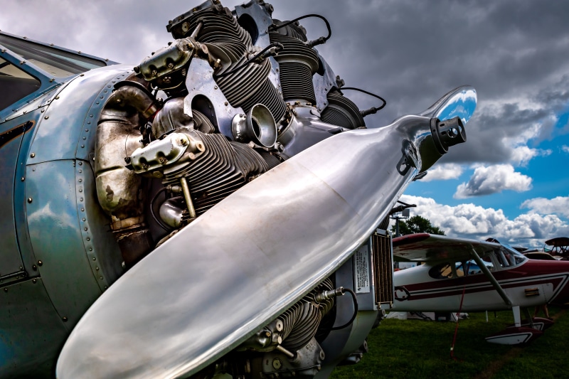 retro, antique, car, mode of transportation, aviation, low angle view, vintage, aircraft, sky, day, junkyard, motor vehicle, air vehicle, outdoors, engine