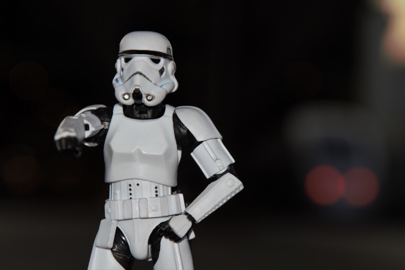 security, looking at camera, space helmet, front view, holding, futuristic, technology, human representation, wars, sports helmet, black background, imperial