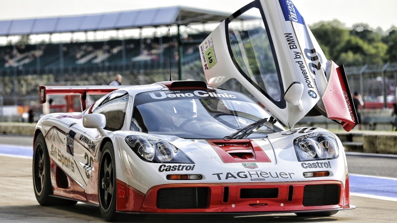 focus on foreground, track and field, competitive sport, day, car, mode of transportation, racecar, sport, western script, sports race, land vehicle, McLaren F1