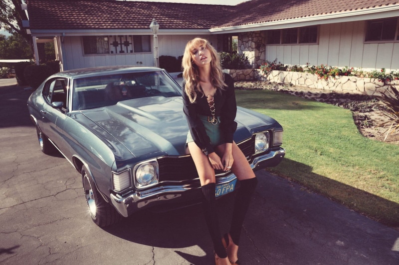 real people, shirt, lifestyles, portrait, land vehicle, blonde, fashion, women, long, young adult, black, sleeved, 1980s, full length, transportation, hair