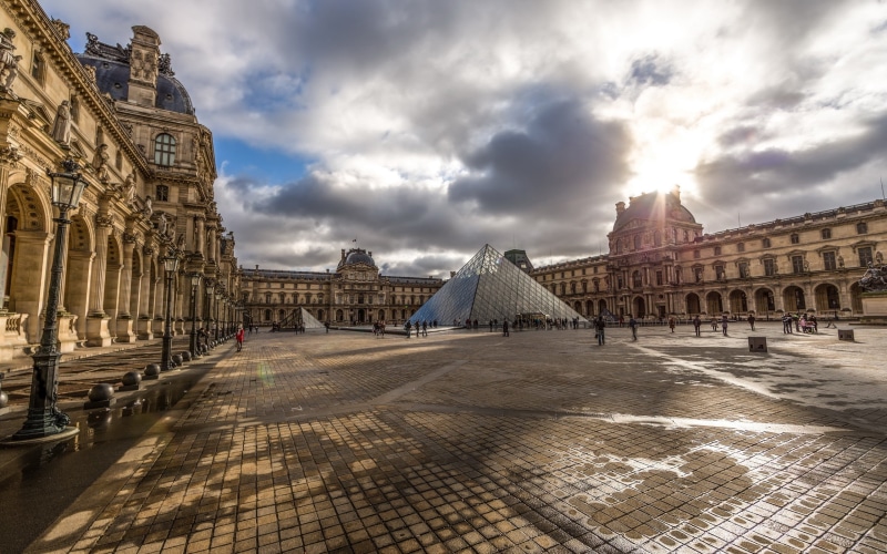 city, building exterior, travel destinations, incidental people, day, ancient, courtyard, sky, 2K, architectural column, built structure, cloud - sky