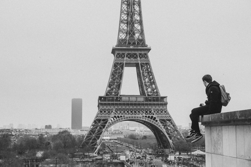 monument, real people, tower, person, architecture, metropolis, city, black and white, building, art, architectural feature, spire, building exterior, downtown