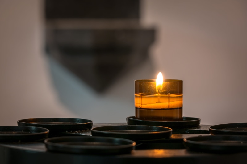christianity, holder, burning, nature, indoors, table, burn, gold, reflection, color, candlestick holder, no people, blur, candle, heat - temperature, fire - natural phenomenon