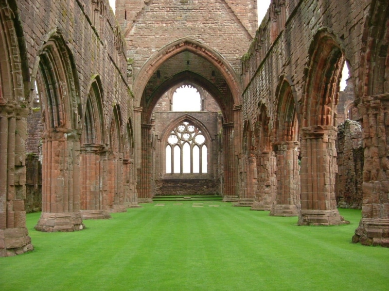 building, abbey, hallway, concrete, built structure, green color, colonnade, the past, place of worship, old, religion, architecture, grass, nature, belief