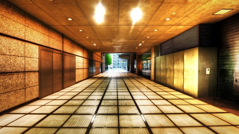 no people, building, tile, underground walkway, direction, lights, indoors, recessed, tiled floor, lighting equipment, diminishing perspective, empty, flooring