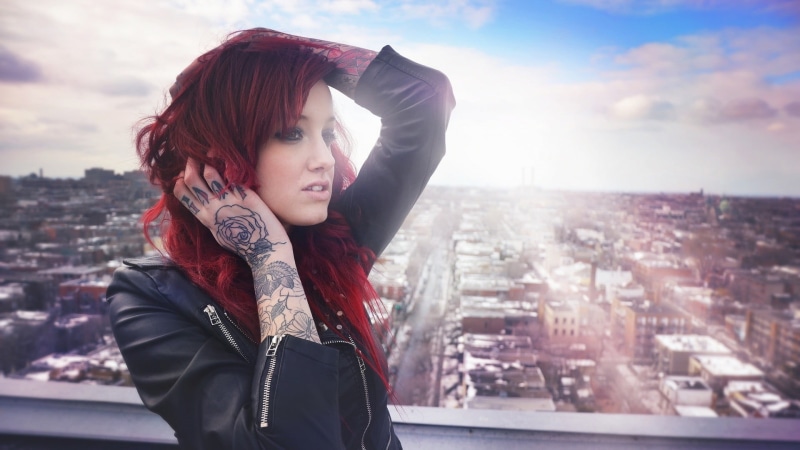black, young adult, standing, hair, tattoo, architecture, built structure, lifestyles, beautiful woman, s, city, leisure activity, one person, building exterior