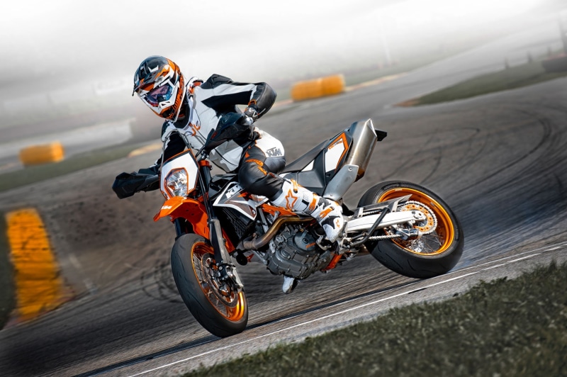 leather jacket, transportation, 2012, mode of transportation, extreme sports, 690, riding, motorcycle, motorsport, one person, helmet, headwear, motor racing track