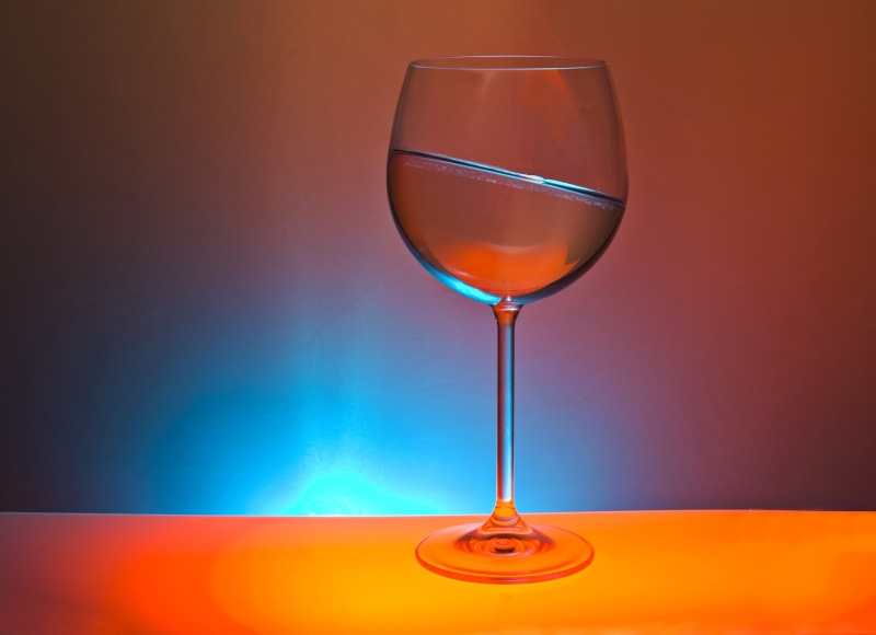 wineglass, light, table, household equipment, glass, alcohol, spotlight, wine, studio shot, wine glass, glass - material, drink, indoors, clear, food and drink