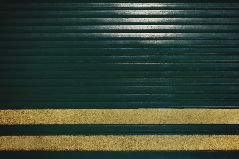 asphalt, sunlight, caution tape, repetition, shutter, textured, banister, floor, 8K, full frame, corrugated, road, no people, wall - building feature