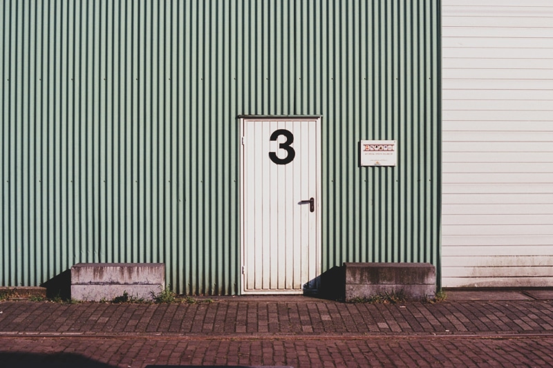 sun, brown, garage, three, entrance, metal, no people, day, bricks, pattern, 2K, white, door, corrugated, road, sign, wall - building feature, sidewalk