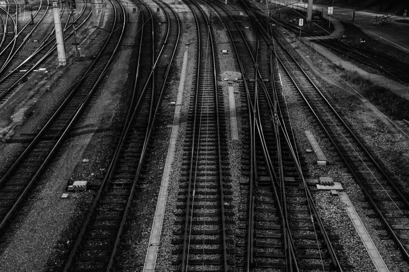 black and white, black, yard, rail transportation, intertwined, 2K, mode of transportation, no people, crossroad, train, high angle view, track, travel