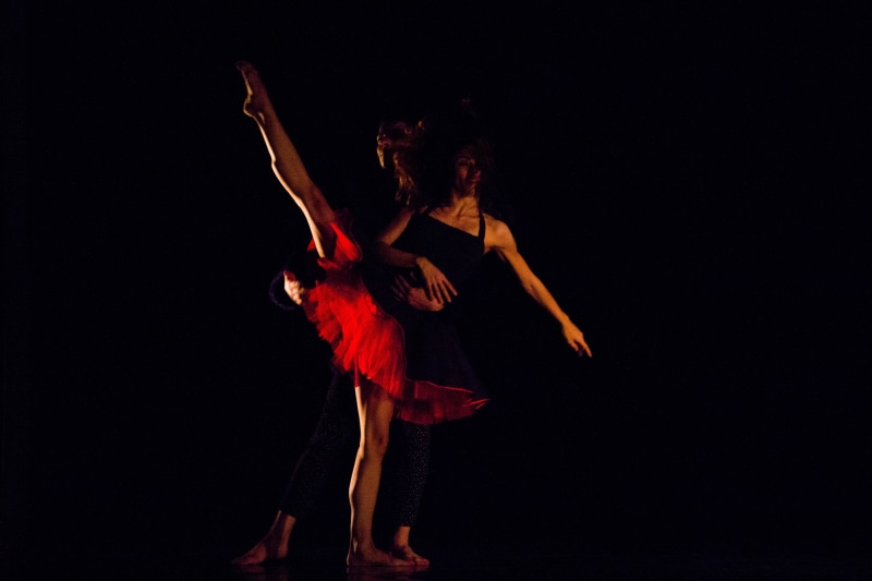 scene, elegance, 5K, studio shot, music, adult, human limb, arms raised, choreography, lighting, barefoot, full length, performance, stage, black background