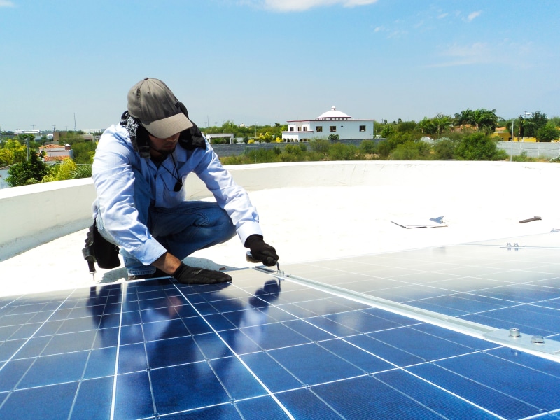 real people, environmental, sky, full length, energy, alternative, photovoltaic, lifestyles, electrical, environment, fuel and power generation, nature