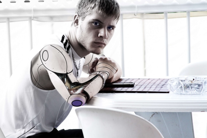 person, emotion, futuristic, sitting, males, adolescence, intelligence, wireless technology, human, technology, one person, table, keyboard, ai, looking at camera
