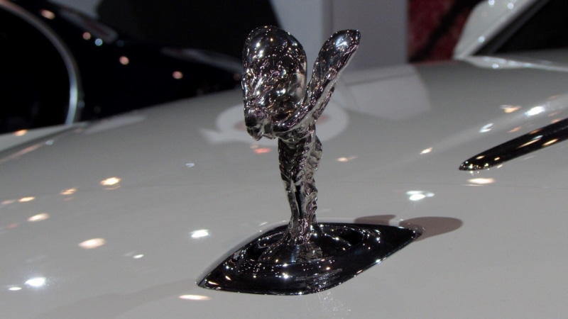 silver colored, falling, wealth, drop, ecstasy, indoors, reflection, night, 1080P, rolls royce, illuminated, studio shot, cars, close-up, emblem, no people