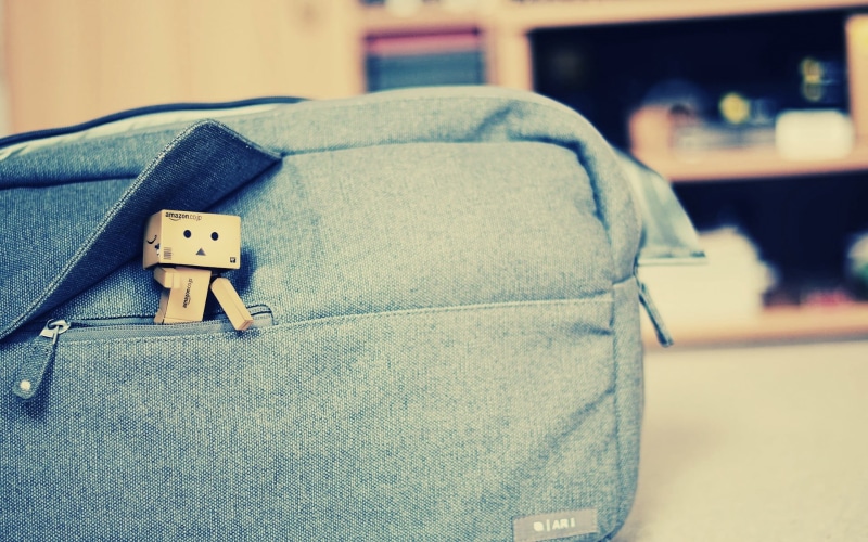focus on foreground, still life, bag, blue, pouch, single Object, close-up, house, boxman, toy, no People, fashion, elegance, robot, indoors, danboard