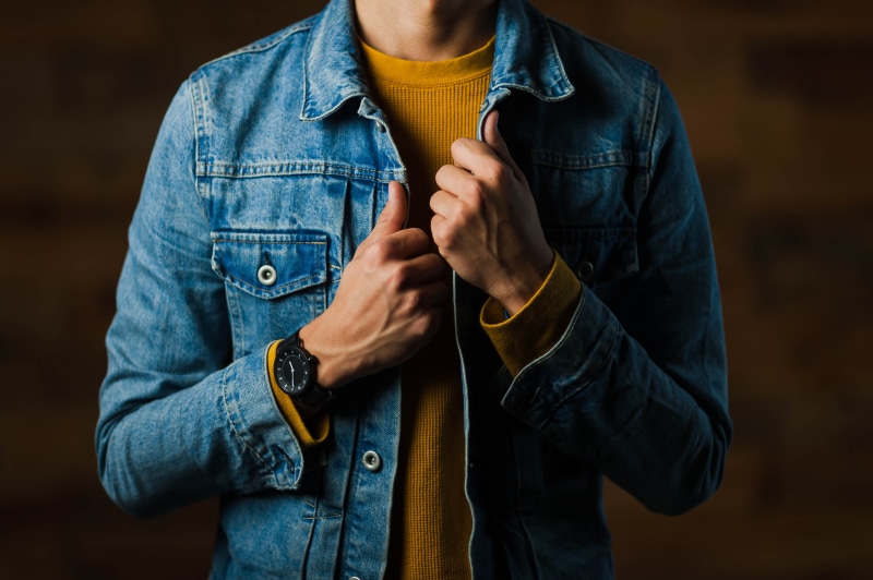 leather jacket, jean jacket, 4K, male, gold, midsection, jeans, yellow, street style, holding, jumper, casual clothing, collar, front view, wearing, adult