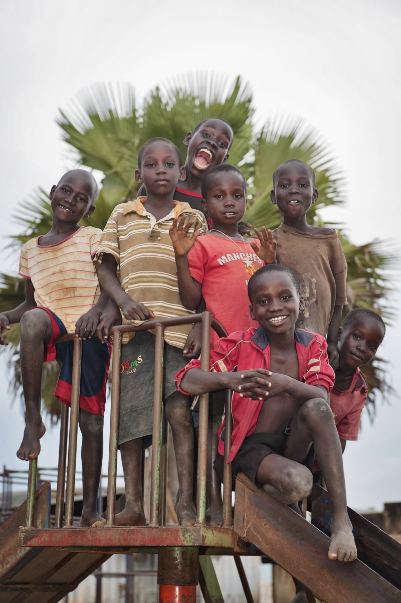outdoors, child, males, smiling, women, lifestyles, portrait, people, religion, smile, happiness, son, happy, sitting, little, real people, boys, men, school