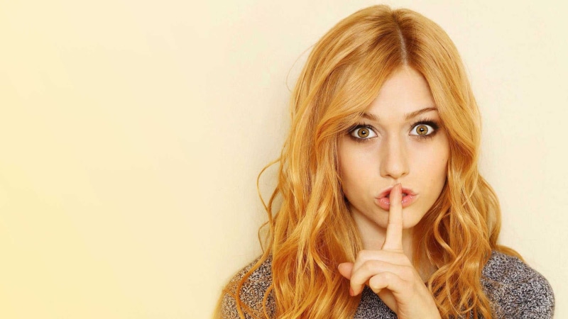 indoors, finger on lips, blond hair, celebrity, headshot, Katherine Mcnamara, looking at viewer, portrait, hair, adult, contemplation, redhead, looking at camera