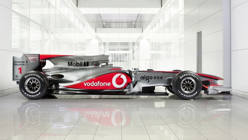 speed, flooring, transportation, mode of transportation, McLaren Formula 1, indoors, text, red, no people, motor vehicle, retail, technology, communication