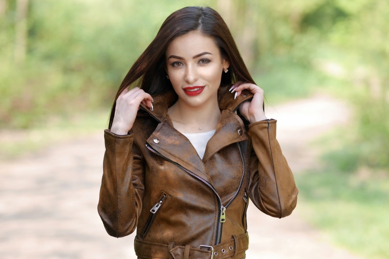 fashion, leather jackets, women outdoors, brunette, women, brown hair, one person, earring, leather, young women, focus on foreground, looking at camera