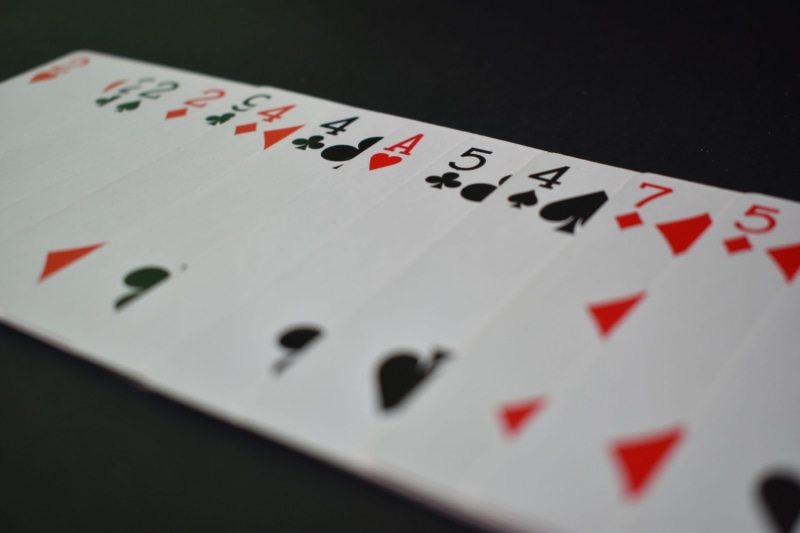 arts culture and entertainment, red, heart, selective focus, game, playing, no people, assorted, indoors, card, leisure games, playing cards, relaxation