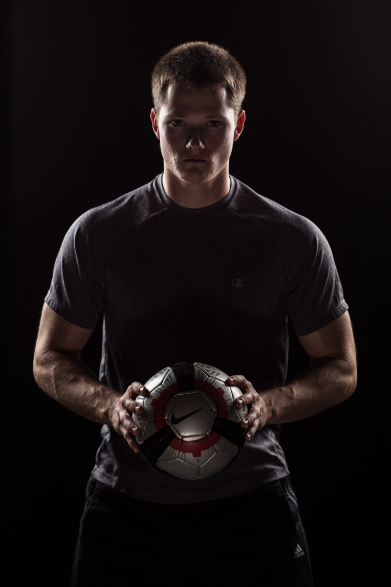 nike, sports, front view, neck, black, model, active, sports Clothing, ball, indoors, t, crew, man, pro, one Person, isolated On Black, studio, male, young Adult