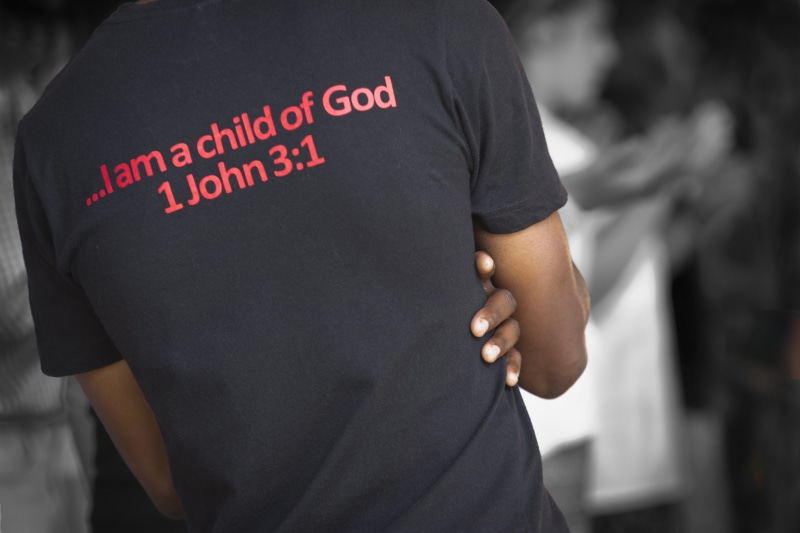 racism, printed, black, bible, safety, person, I am a Child of God, t, real people, 1 John 3, religion, the back of the man, protest, men, government, text