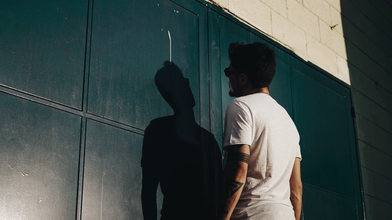 bonding, architecture, view, tattooed, t, people, shadow, white t-shirt, standing, casual clothing, back view, shirt, togetherness, facing, rear view, man