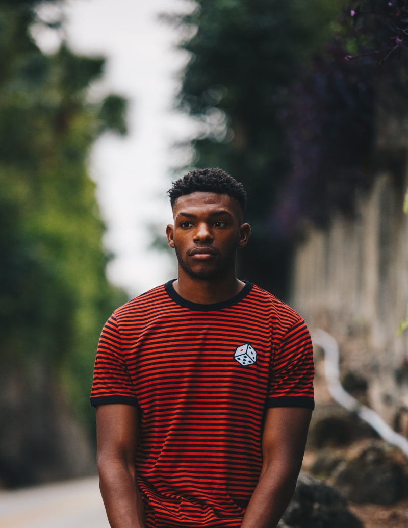 lifestyles, casual clothing, tree, striped, photography, stripe, island, outdoors, man, standing, tee, looking at camera, waist up, portrait, front view
