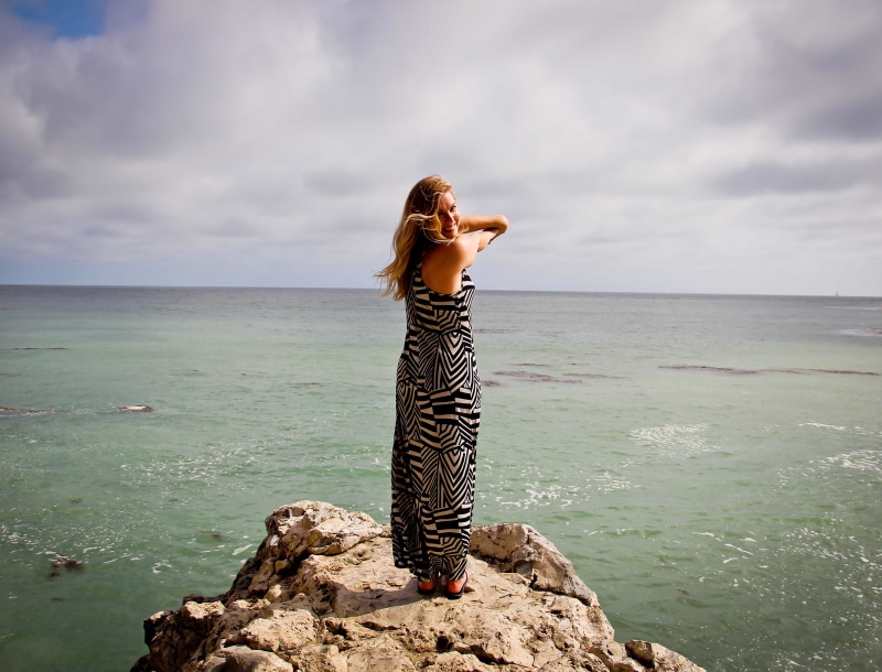 one person, peace, healthy, cloud - sky, white, young adult, woman in black, one woman only, ocean, black, lifestyle, relaxation, looking at view, cliff
