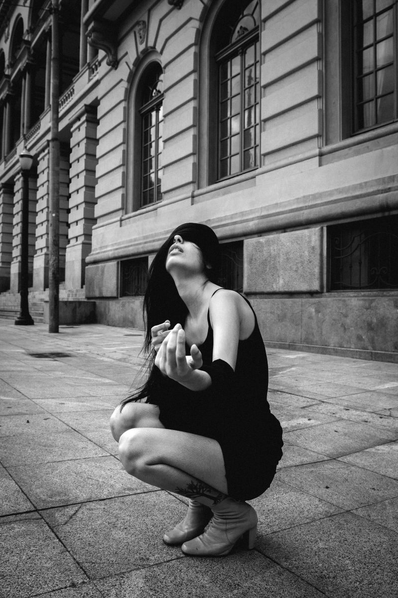 leisure activity, photoshoot, real people, built structure, day, women, building exterior, model, casual clothing, squat, black and white, lifestyles, position