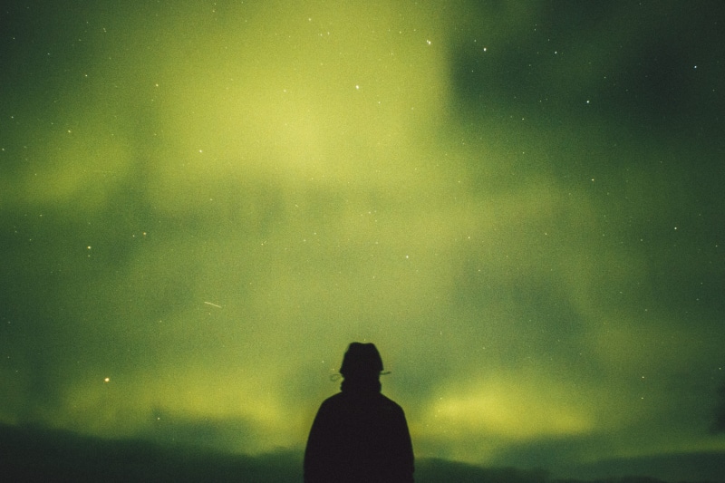 sky, space and astronomy, faceless, adult, scenics - nature, aurora, beauty in nature, person, outdoors, tranquility, background, green, star - space, nature