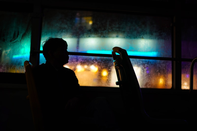 looking, one person, man, males, headshot, seatting, gray, silhouette, looking out the window, window, indoors, men, city, chair, window view, emotion