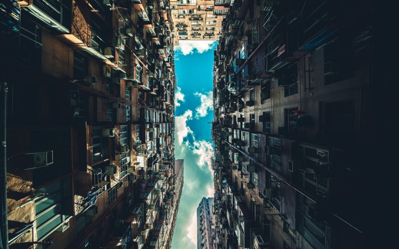 sunlight, angle, low angle view, city, clouds, window, architecture, built structure, abundance, high, building exterior, cityscape, directly below, sky