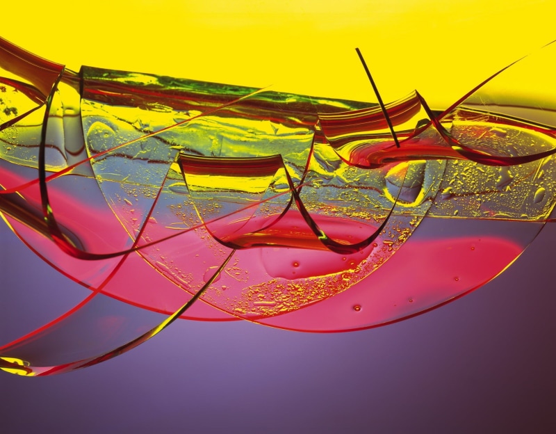 futuristic, studio shot, eyeglasses, close-up, colorful, sea, sunset, swirl, yellow, design, shards, personal accessory, circle, vibrant Color, celebration