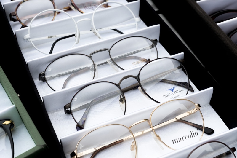 high angle view, communication, glasses, glass items, close-up, specs, optical, text, vision, still life, seat, indoors, optics, lenses, table, choices